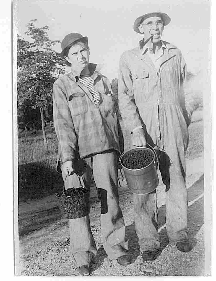 Claude Clawson and sister Edith picking berries
